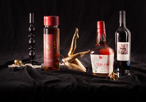 Spirit and wine bottles with premium printed labels on black fabric